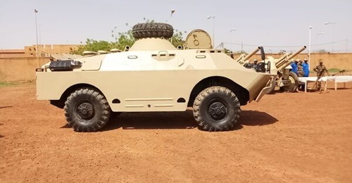 One of the BRDM-2 armoured reconnaissance vehicles donated by Egypt with M-30 howitzers in the background.