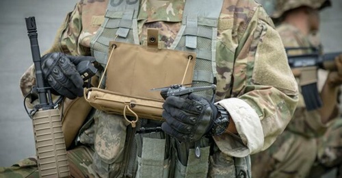 Ukraine is one of more than 30 countries known to be operating Black Hornet systems. Pictured is a Black Hornet 3 with a monitor, attached to a soldier's combat flack vest.
