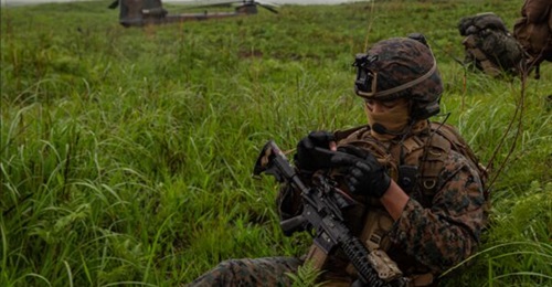 A US marine operates an Android Tactical Assault Kit (ATAK) during a May 2021 multilateral assault exercise with Australian, French, and Japanese forces at Kirishima Maneuver Area.