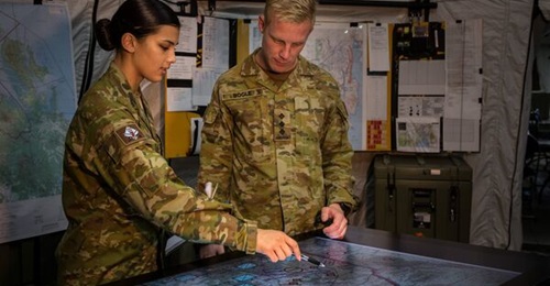 Australian Army officers work in the joint operations room at Gallipoli Barracks in Brisbane in November 2016. The Australian Army's battlefield management capabilities are expected to improve under the LAND 200 Phase 3 Battlefield Command Systems proj...