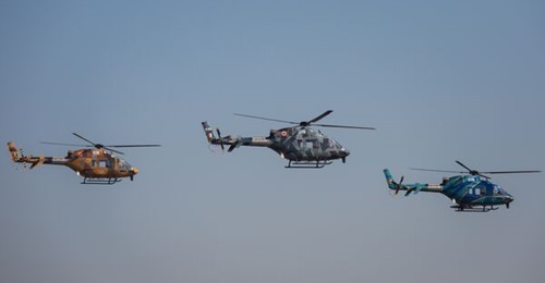 HAL Light Utility Helicopters perform during the inauguration of the Aero India 2023 show at the Yelahanka Air Force Station on 13 February 2023 in Bengaluru, India. The five-day event is held to showcase India's aerospace and defence capabilities.