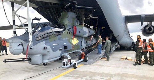One of the first two AH-1Z Viper attack helicopters being unloaded from a US Air Force C-17 cargo aircraft on 26 July.