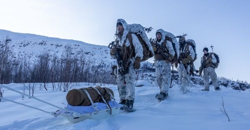 US Marines hike as a part of Marine Rotational Force-Europe in Setermoen, Norway, in February 2023.