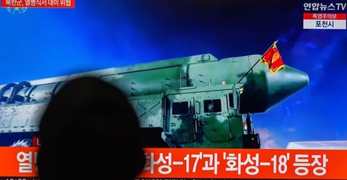 A TV screen showing an image of the Hwasong-18 intercontinental ballistic missile at a North Korean military parade to mark the 70th anniversary of the signing of the armistice.