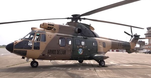 A still from television footage shows one of Benin's three new Super Puma helicopters in Jordanian camouflage.