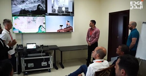 The Brazilian naval delegation watch screens showing satellite imagery of Abu al-Abyad island during the Sig4l demonstration.