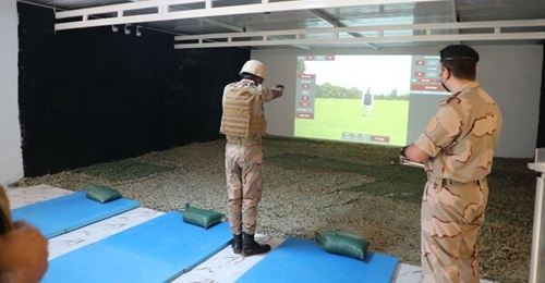 NATO is helping to develop simulation capabilities for the Iraqi Armed Forces. Pictured is a soldier using the new handgun simulator at the Tactical Training and Special Combat School.