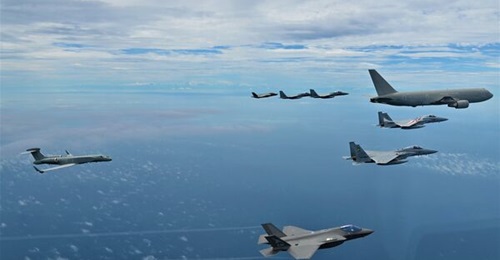 An Italian Air Force G550 CAEW aircraft (far left) flies with one ITAF KC-767A, two ITAF F-35A Lightning II fighters, and four Japan Air Self-Defense Force F-15s over Japan on 8 August.