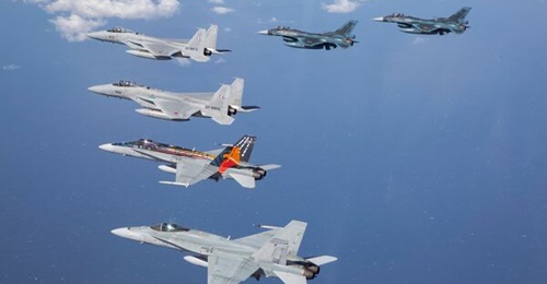 RAAF F/A-18A Hornets from No 77 Squadron fly in formation with JASDF fighter aircraft, including the F-15J and F-2A, during Exercise 'Bushido Guardian 2019' conducted out of Chitose Air Base in Japan.