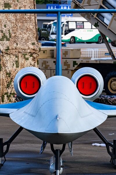 Front view of the new CH-6 armed reconnaissance UAV, showing its chined fuselage, turbofan engine pods, and T-tail.