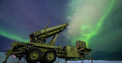 The northern lights glow behind a Patriot M903 launching station assigned to 5th Battalion, 52nd Air Defense Artillery Regiment, during Exercise 'Arctic Edge 2022' at Eielson Air Force Base, Alaska, on 5 March 2022. The Patriot system allows soldiers t...