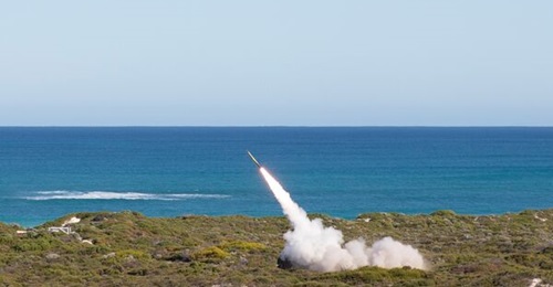 A US Army HIMARS launcher from the 17th Field Artillery Brigade fires its first salvo at the Lancelin Defence Training Area in Western Australia as part of Exercise 'Highball'.