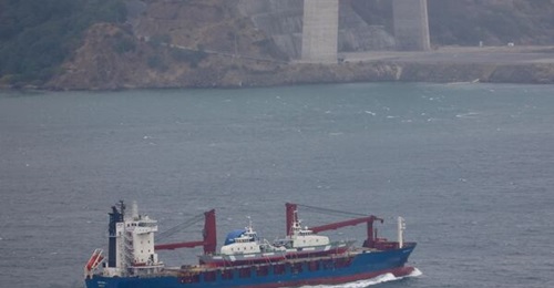 A heavy lift cargo ship is pictured transiting northbound through the Bosphorus Strait loaded with two FPB 98 MKI patrol boats at 1400 h GMT on 13 August.