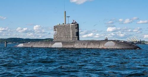 Victoria-class submarine HMCS 
        
         sails through Halifax Harbour. The submarine class is slated for modernisation.