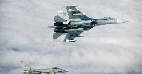 A Royal Air Force Eurofighter Typhoon intercepts a Russian Sukhoi Su-27 'Flanker' over the Baltic region. The House of Commons Defence Committee has warned that recent cuts to the UK's combat aviation capabilities have left the country 'dangerously exp...