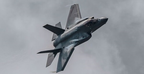 An F-35A flies over the Toronto waterfront on 5 September 2021 during the Canadian International Air Show. The Pentagon and Lockheed Martin have agreed to adjust expectations for future deliveries of the F-35, also known as a production rebaseline.