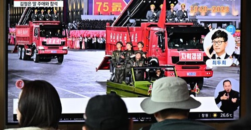People watching a South Korean news broadcast in Seoul showing a parade to mark North Korea's 75th founding anniversary on 9 September 2023.  Spotted at the parade were what appears to be the M1985 multiple launch rocket system that has been incorporat...
