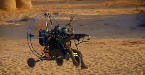 Screenshot from a Hamas video shows Palestinian militants using a paraglider to infiltrate the Gaza-Israel border on 7 October.