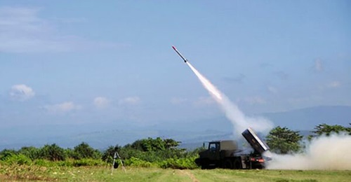 The R-Han rocket, pictured above, being test-fired from a locally developed Rantis MLRS.