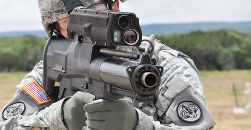 A soldier aims a XM25 Counter Defilade Target Engagement system during testing at Aberdeen Test Center in Maryland.