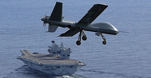 A Mojave short take-off and landing unmanned aircraft lines up for the first landing aboard a Royal Navy Queen Elizabeth-class aircraft carrier.