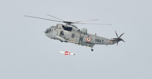 An Indian Navy Sea King Mk 42B helicopter firing a Naval Anti-Ship Missile - Short Range as part of the weapon's guided flight trials.