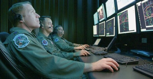 EW officers monitor a simulated test in the Central Control Facility (CCF) at Eglin Air Force Base in Florida. The CCF is used to oversee EW mission data flight-testing. Portions of their missions are likely to expand under the new Air Force Cyber Comm...