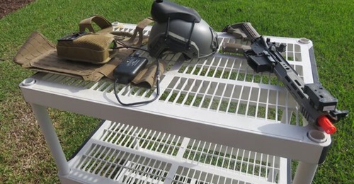 The components of Lockheed Martin's SIMRES geo-pairing system include a player unit, a helmet sensor, and a weapon sensor mounted on the barrel of an Airsoft weapon that was being used for demonstration purposes.