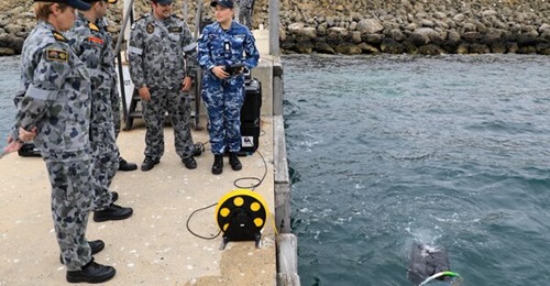 Personnel from the Royal Australian Navy test an unmanned underwater vehicle (UUV) in Western Australia in 2021. Australia will collaborate with Japan to develop communication technologies that can enhance the interoperability of UUVs used by both coun...