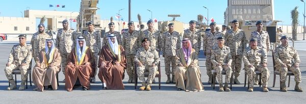 Field Marshal Sheikh Khalifa bin Ahmed al-Khalifa poses with air defenders from the Royal Bahraini Air Force in front of Patriot and HAWK components at Camp Ras al-Bar.