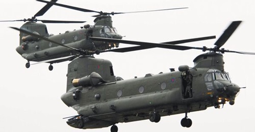 The UK is to review plans to buy 14 new H-47 ER Chinooks to augment its existing fleet of older model helicopters (pictured).