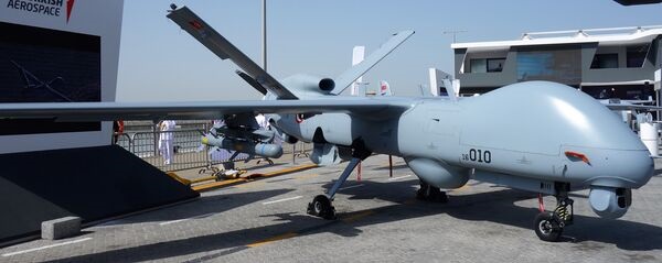 An Anka MALE UAV equipped with sensors and weapons at IDEX 2023, Abu Dhabi. This UAV was armed with MAM-L munitions and a SIMSEK aerial target on the port hardpoint (not visible in this photograph).