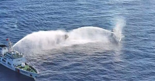 China Coast Guard vessels dousing Philippine supply boat 
        
         with water cannons in the latter's mission to resupply BRP 
        
         with provisions on 5 March 2024.