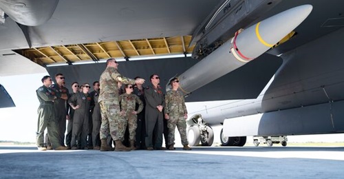 US B-52 Stratofortress crews look at an AGM-183 Air-Launched Rapid Response Weapon (ARRW) during a hypersonic weapon familiarisation briefing at Andersen Air Force Base, Guam, on 27 February. The yellow bands on the missile indicate that it is a live r...