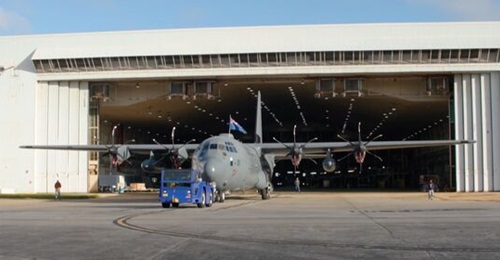 In a screenshot from a New Zealand Defence Force (NZDF) video, the Royal New Zealand Air Force's (RNZAF's) first C-130J-30 Hercules emerges from the Lockheed Martin paint shop with RNZAF and squadron livery on 15 February 2024.