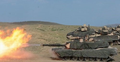 An M1A2 Abrams tank crew assigned to Charlie Company, 2nd Battalion, 5th Cavalry Regiment, 1st Armored Brigade Combat Team, 1st Cavalry Division fires during a training event in the country of Georgia.