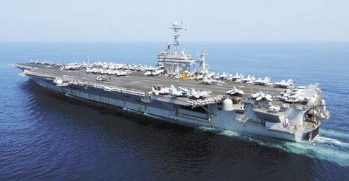 The US Navy is requesting additional funding for the overhaul work on aircraft carrier USS
        
         to cover costs associated with the ship's redelivery delay.