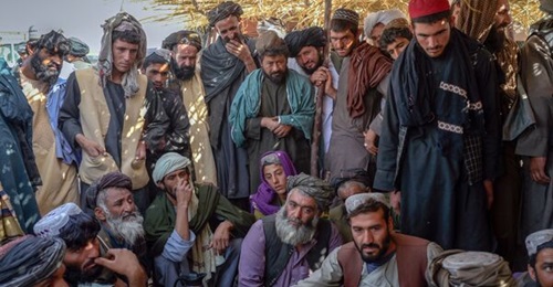Vendors trade heroin and hashish at a drug market on the outskirts of Kandahar, Afghanistan, on 24 September 2021. Although the country's economy is close to collapse, opium traders claim that prices for their goods have skyrocketed since the Taliban t...