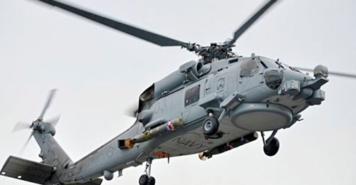 An Australian MH-60R helicopter seen with an Mk 54 torpedo during a firing serial in Florida.