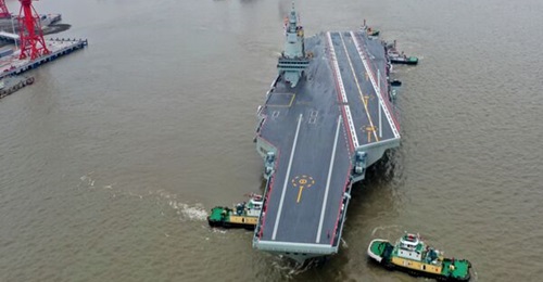 , China's third aircraft carrier, seen here as it departs for its maiden sea trial on 1 May 2024.