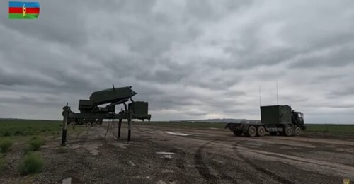A still from a video shows an ELM-2084 radar being deployed during an Azerbaijani artillery exercise.