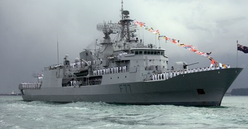 HMNZS 
        
        , seen here while it was in the Singapore Strait. The frigate has sustained damage to its hull after a berthing accident, and repair work is ongoing.