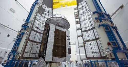 Workers prepare MUOS 4 for a scheduled launch.