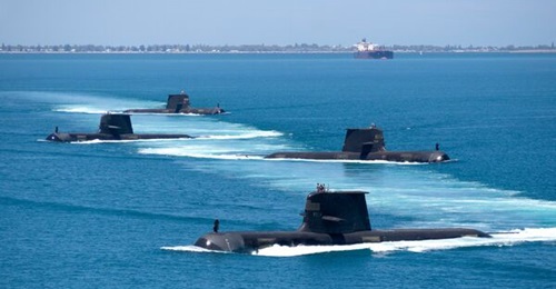 Australia's Collins-class SSKs, four of which are seen here in formation while transiting through Cockburn Sound, will not be armed with Tomahawk cruise missiles as considered earlier.