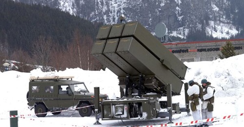 A Royal Norwegian Air Force NASAMS ground-based air-defence missile system with a six-canister AMRAAM launcher.