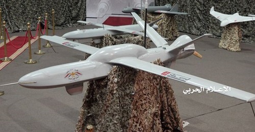 A Samad-3 UAV with its additional fuel tank mounted over its wing box is seen in a 7 July 2019 Houthi display.