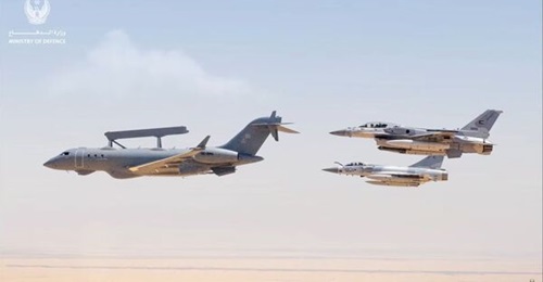 A file photo of a GlobalEye AEW&C platform in UAE service, accompanied by a pair of national F-16 fighters. The emirate has now received all five of the platforms it ordered from Saab.