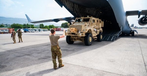 A US service member transported mine-resistant ambush-protected (MRAP) MaxxPro vehicle to Port-au-Prince, Haiti, using US Air Force C-17 transport aircraft.