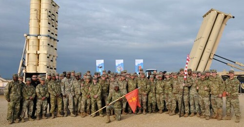 US Army soldiers during the closing ceremony held on 25 March 2019 for an exercise involving the deployment of a THAAD battery to Israel. A THAAD launcher can be seen on the right, and one from the Israeli Arrow Weapon System on the left.