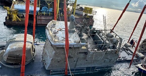 KD 
        
         seen here while it was being raised from the site where it sank.